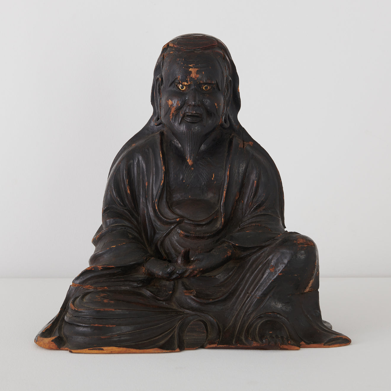 CARVED WOOD OPEN-EYED SITTING BUDDHA